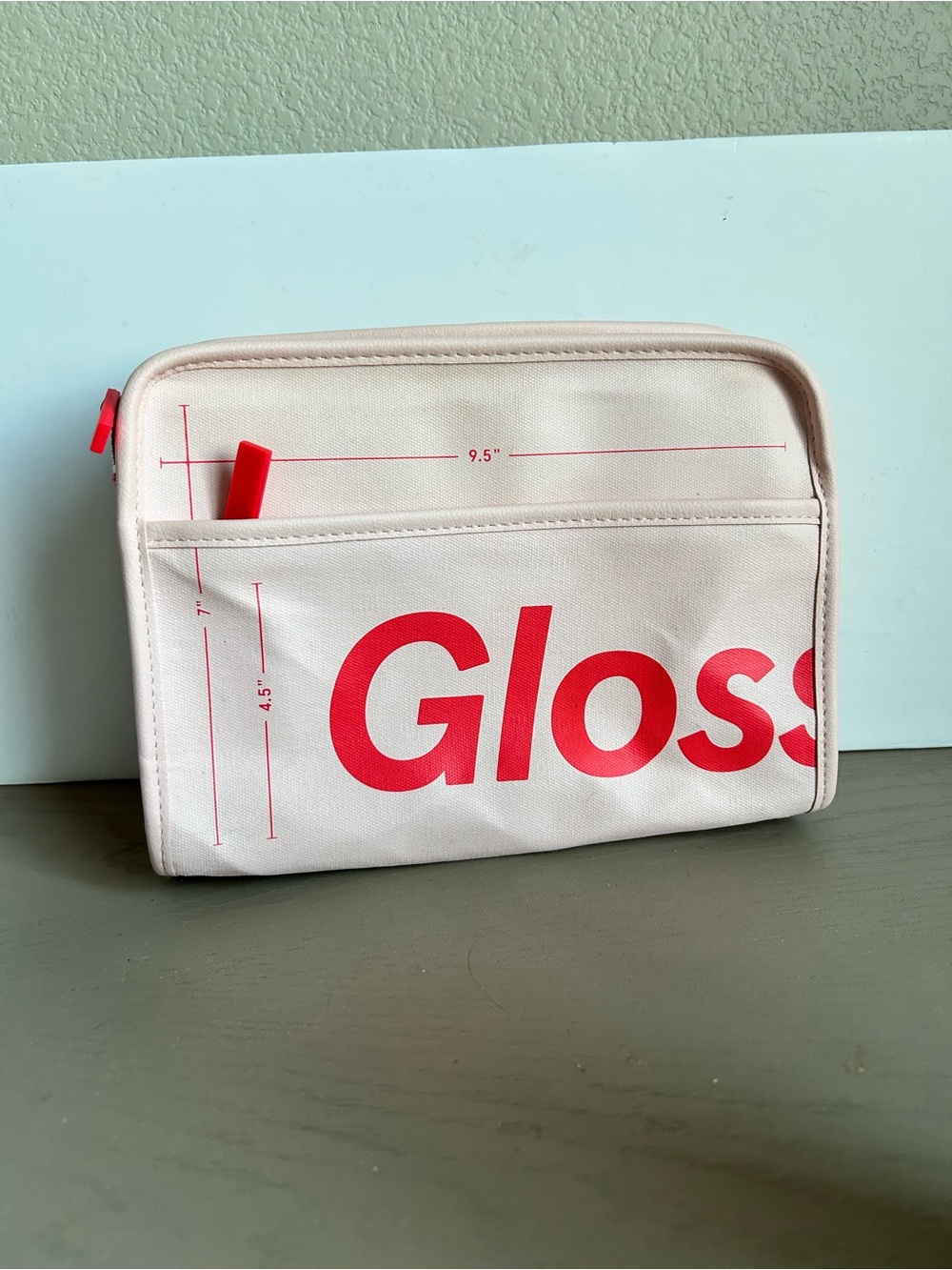 Glossier Cream and Bright Red Logo cosmetic bag